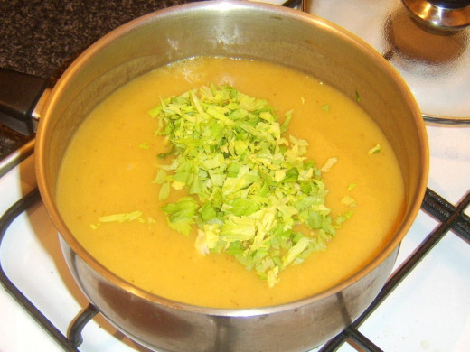 Chopped celery leaves are added to soup