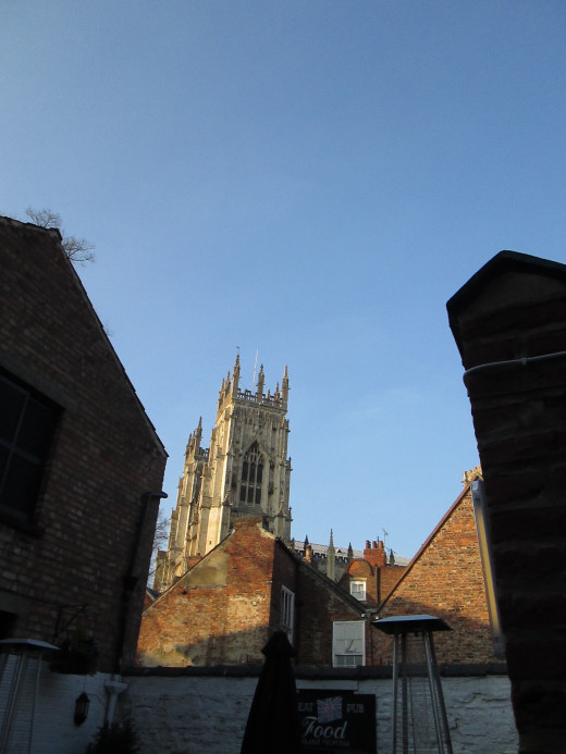 The western front of the cathedral seen from the beer garden of Ye Old Starre Inn on nearby Stonegate 