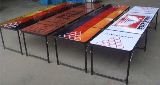 A wooden pattern and a German flag beer pong table among others
