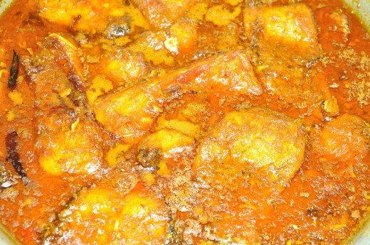 Fish pieces cooking in the masala
