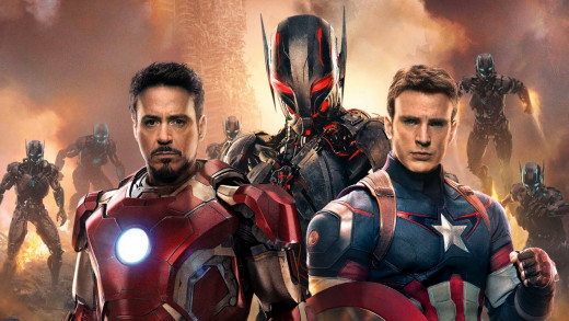 Robert Downey Jr. and Chris Evans pose in front of Ultron and his army of robotic drones.