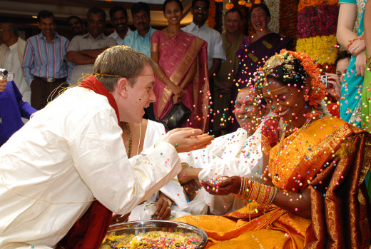 Showering of talambralu (turmeric rice grains) on each other's head.