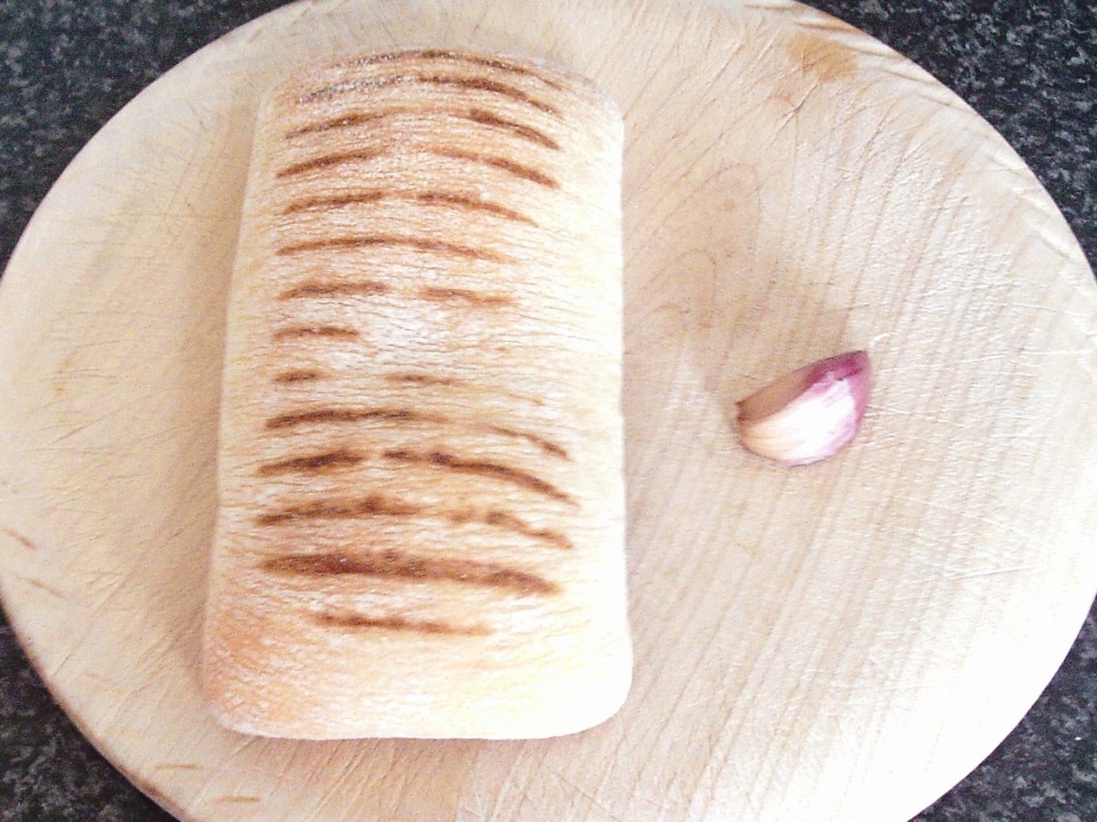 Ciabatta roll and garlic for making bruschetta