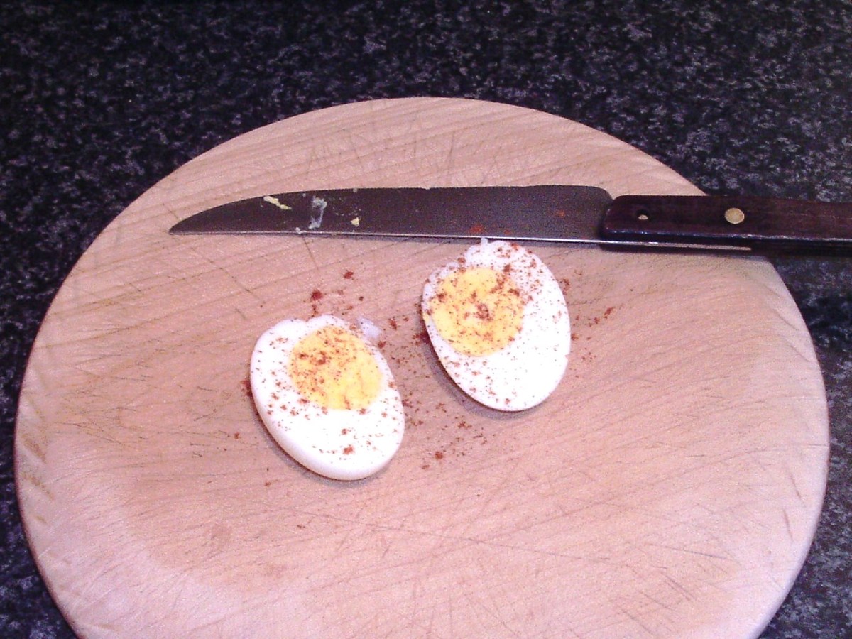 Hard boiled egg is seasoned with paprika