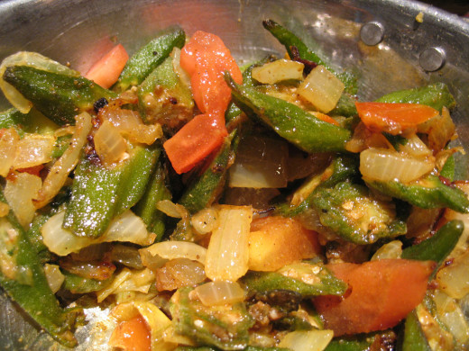 Bhindi frying with onions and tomatoes