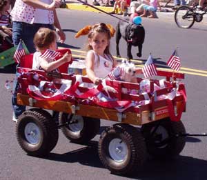 The cute kiddo's are having themselves a ball in their annual July 4th parade.