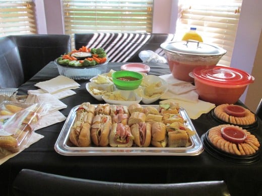 A beautiful array of appetizers from dips, chips and sandwiches.