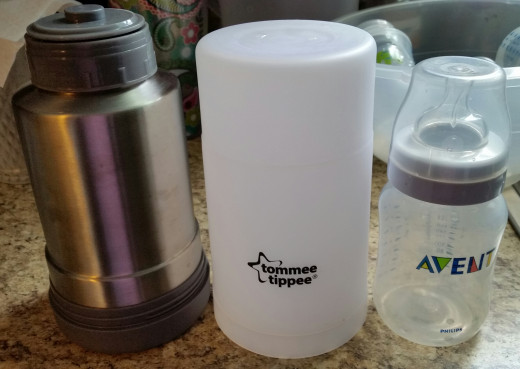 Bottle warmer and carafe next to Avent 9-ounce bottle.