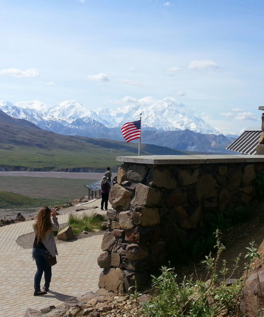 At the Eilson Visitors center, still over 40 miles from Denali as the proverbial crow flies, the wind-whipped US flag pays homage to the power of nature.