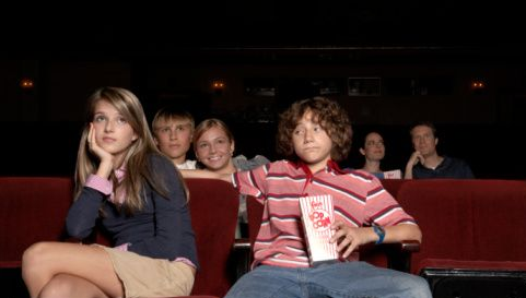 Oops! This guy was busted doing one of the things a teen boy should never do with his date at the movies.