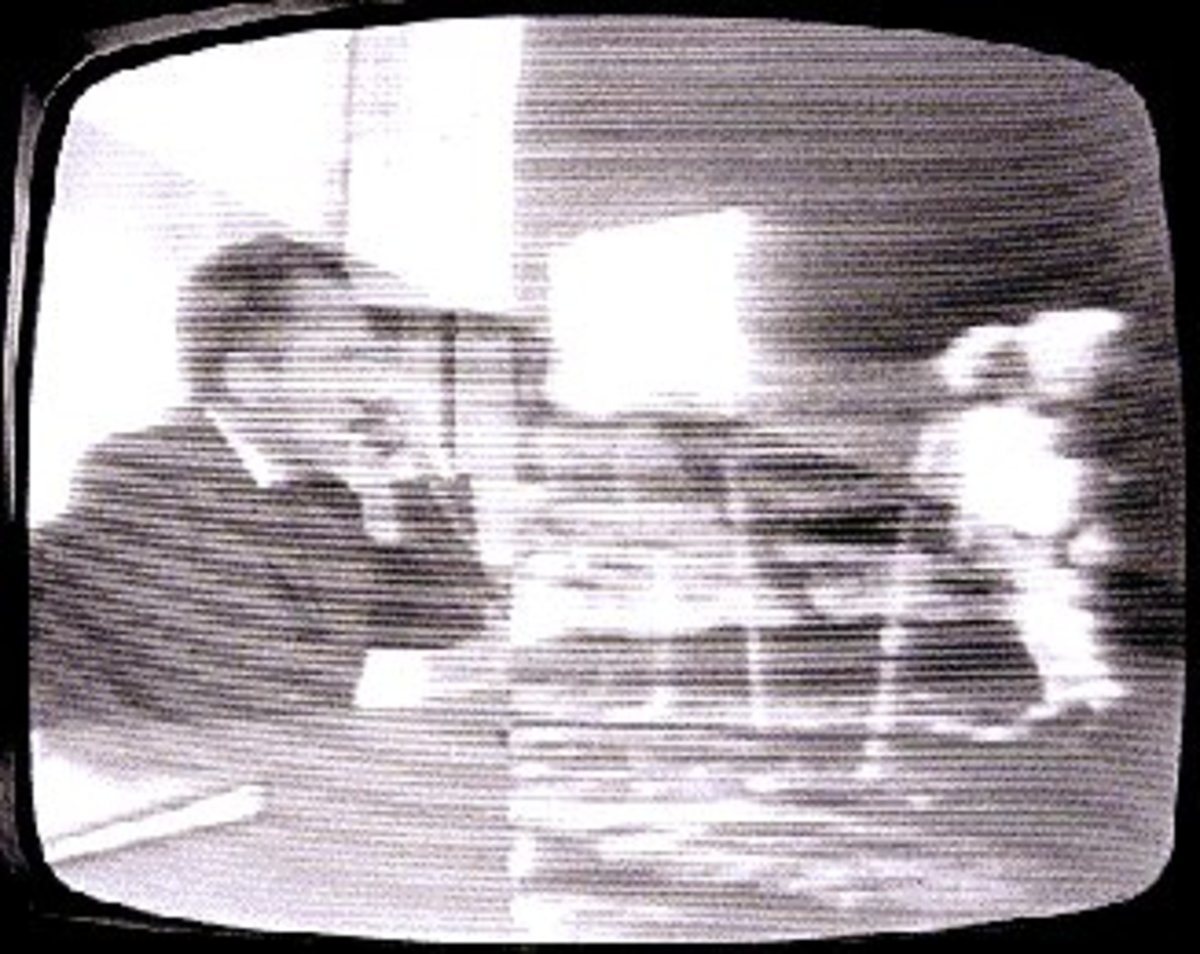 A split screen showing President Nixon on Earth talking to Niel Armstong and Buzz Aldrin on The Moon.