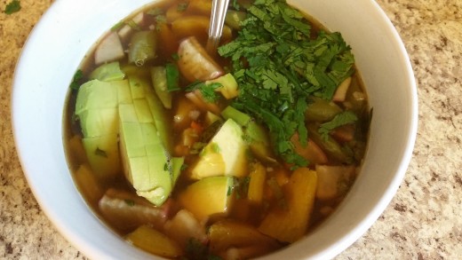 Chicken bone broth serves as the base for this vegetable soup that contains carrots, peppers, beans, radishes, avocado, and cilantro.