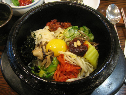 A colorful and flavorful mix of ingredients for a bowl of bibimbap. Yummy!