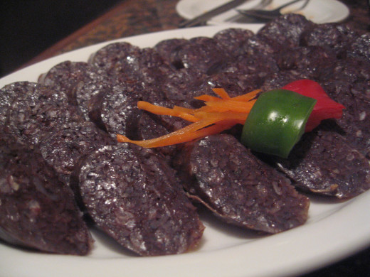 Try a bite of this Korean blood sausage. A delicious treat with sundae.