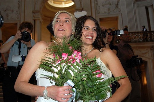 Same-sex marriage of a woman to another woman. 
