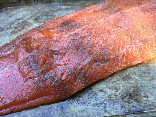 Season Salmon with salt and pepper