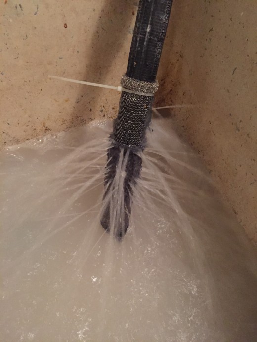This is a lint snare in use as the water is discharged from the washing machine hose