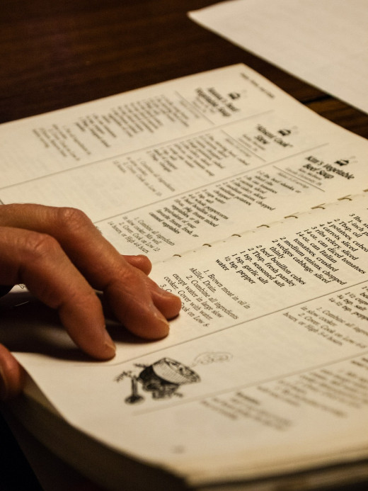 You can look up recipes for your delicious meals using a cookbook.  