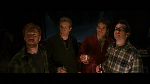 Four friends sharing a beer before the trouble starts