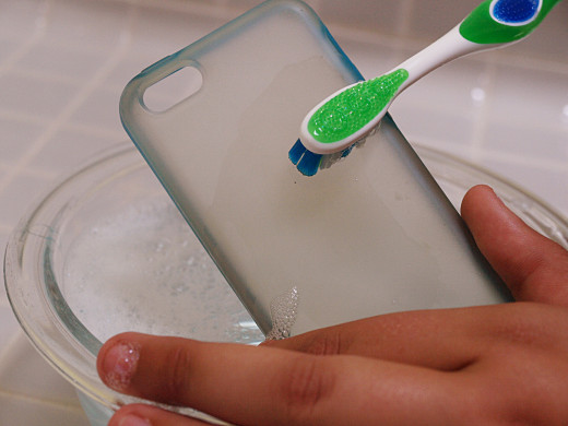 To remove mild stains, dust, and grime from your silicone case, use warm water, dish soap, and a toothbrush.