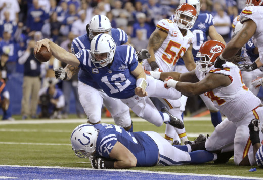 Andrew Luck diving into the endzone after recovering a fumble. 