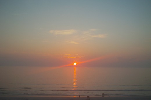 Sunrise over Calm Ocean