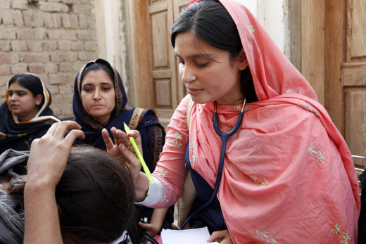 Doctor with the International Medical Corps with patients in Pakistan.