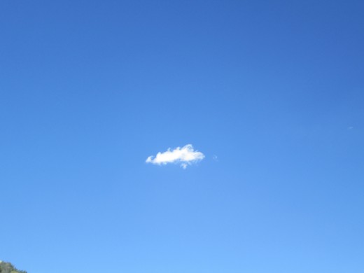 A solitary cloud floating in the sky.