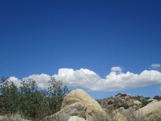 Triangle shaped rocks and clouds in the sky.