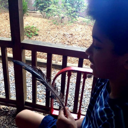 Nicholas received his first of many peacock feathers collected that day on the visit to Hattiesburg Zoo.