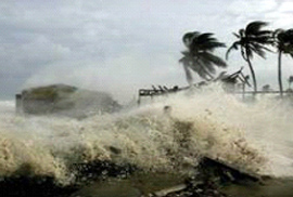 Waves created by Hurricane Gilbert, a category 3 hurricane, severely damages waterfront properties and beaches.