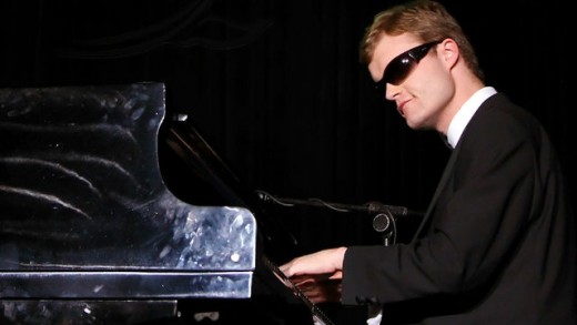 Derek Paravicini playing the piano