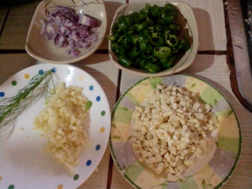 Chopped onion in small pieces, the same with garlic, sliced pepper and the most important one, finely chopped pili nuts. Photo Source: Ireno Alcala
