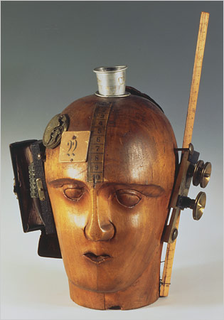 "Mechanical Head (Spirit of Our Age)" by Raoul Hausmann. The sculpture is made from a hairdresser's dummy, parts of a pocket watch, pieces of a camera, tape measure and other objects.