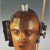 "Mechanical Head (Spirit of Our Age)" by Raoul Hausmann. The sculpture is made from a hairdresser's dummy, parts of a pocket watch, pieces of a camera, tape measure and other objects.