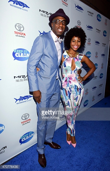 Actor J.B. Smoove and Shahidah Omar get their photos shot at a film premiere.