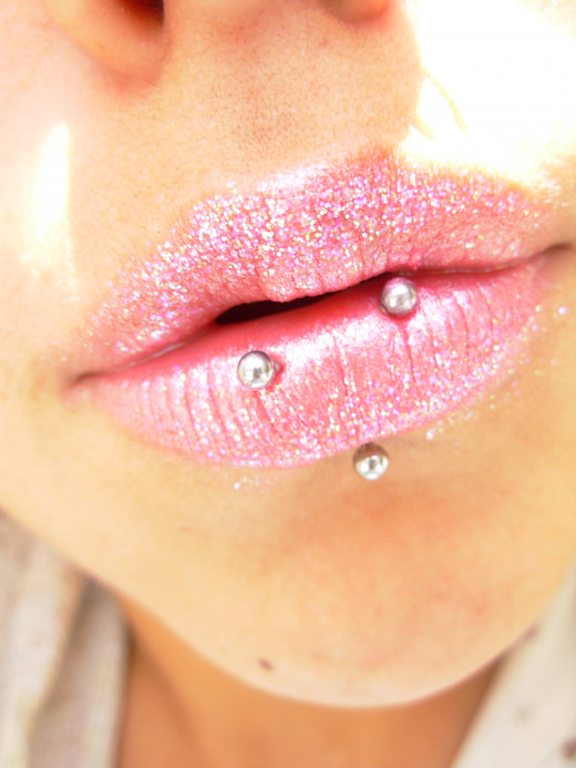 yeah, I got sparkly lips.. my peircing is all off center...lol..it's cuz I chew on one side..