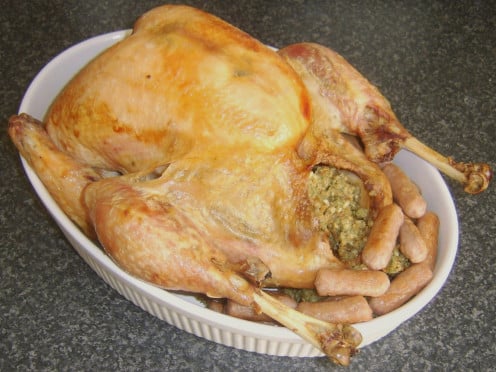 Perfectly roasted turkey with stuffing and mini sausages