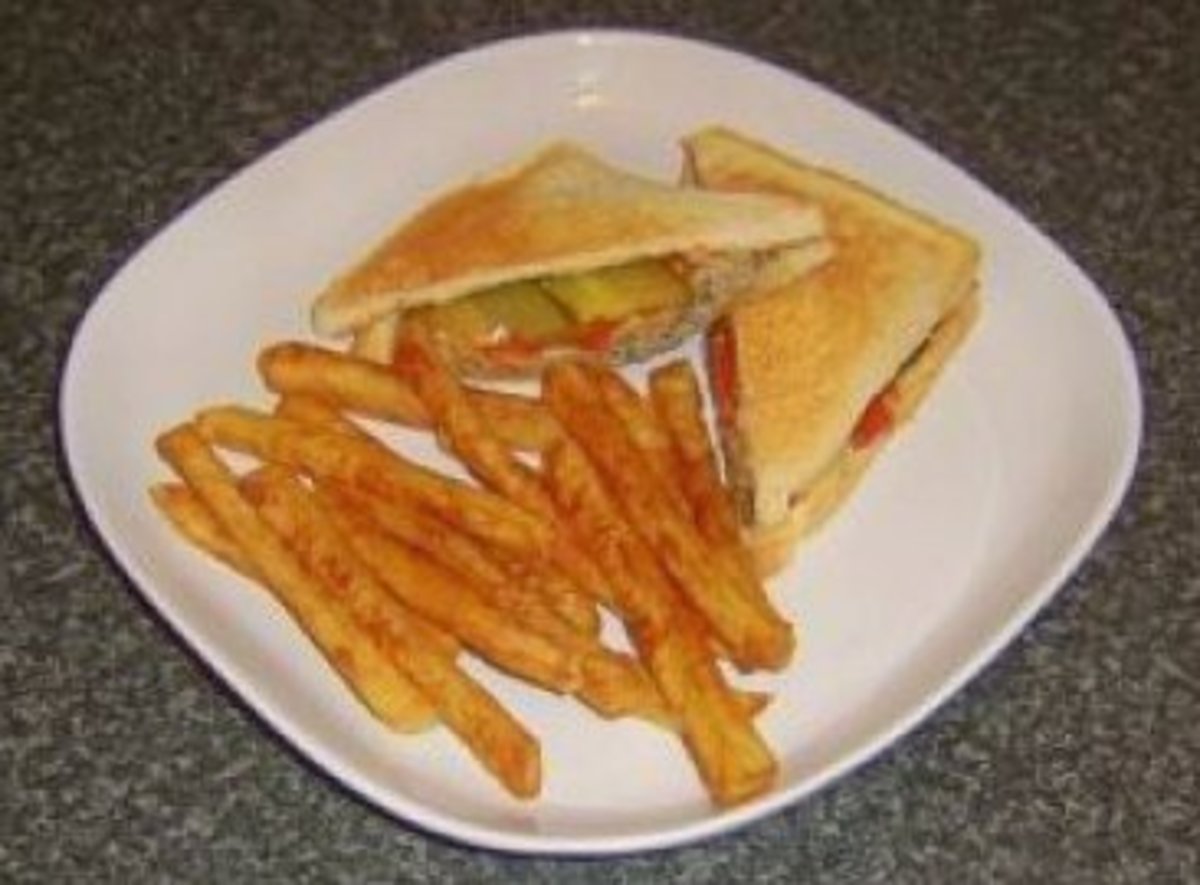 Cheeseburger themed toasted cheese sandwich with fries