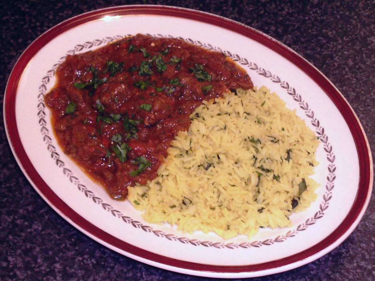 Hot and spicy kangaroo curry served with turmeric and garlic rice
