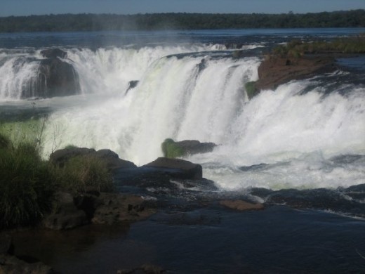 Argentina Side of Iguazu Falls, Brazil is seen in the distance