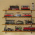 Models are stored inside on our train wall in an entertainment room. 