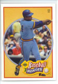 Hank Aaron on a baseball card showing him slugging in a Brewers uniform.