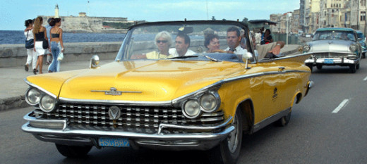 Vintage cars on the road are a common sight in Cuba.