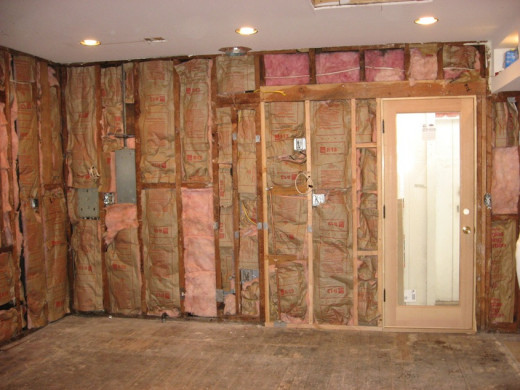 Pink insulation inside of walls. Notice the vapor shield is facing in towards the house.