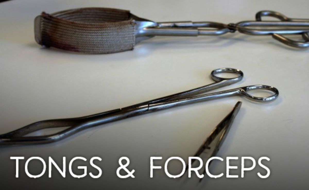 Two tongs above and a pair of forceps below