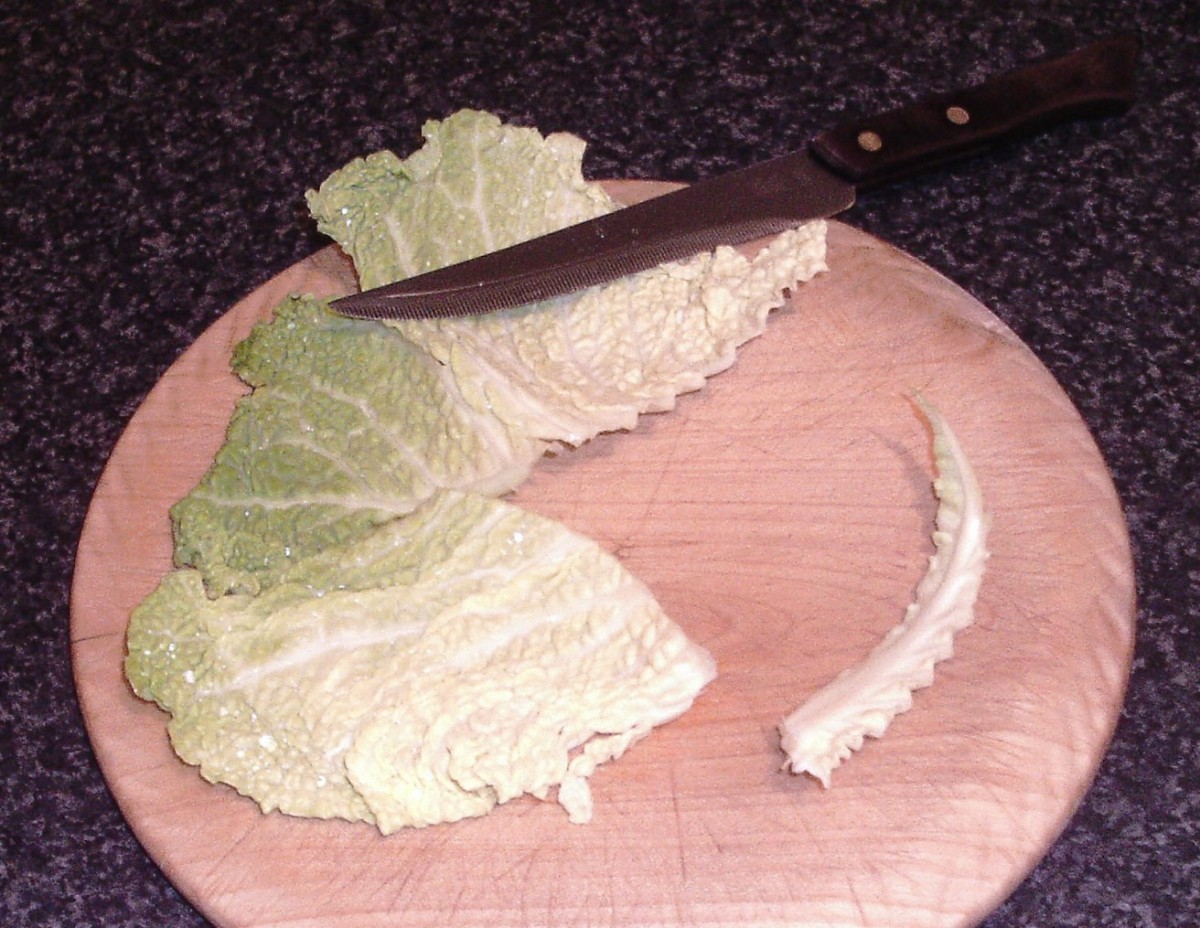 Cutting tough central core from cabbage leaves