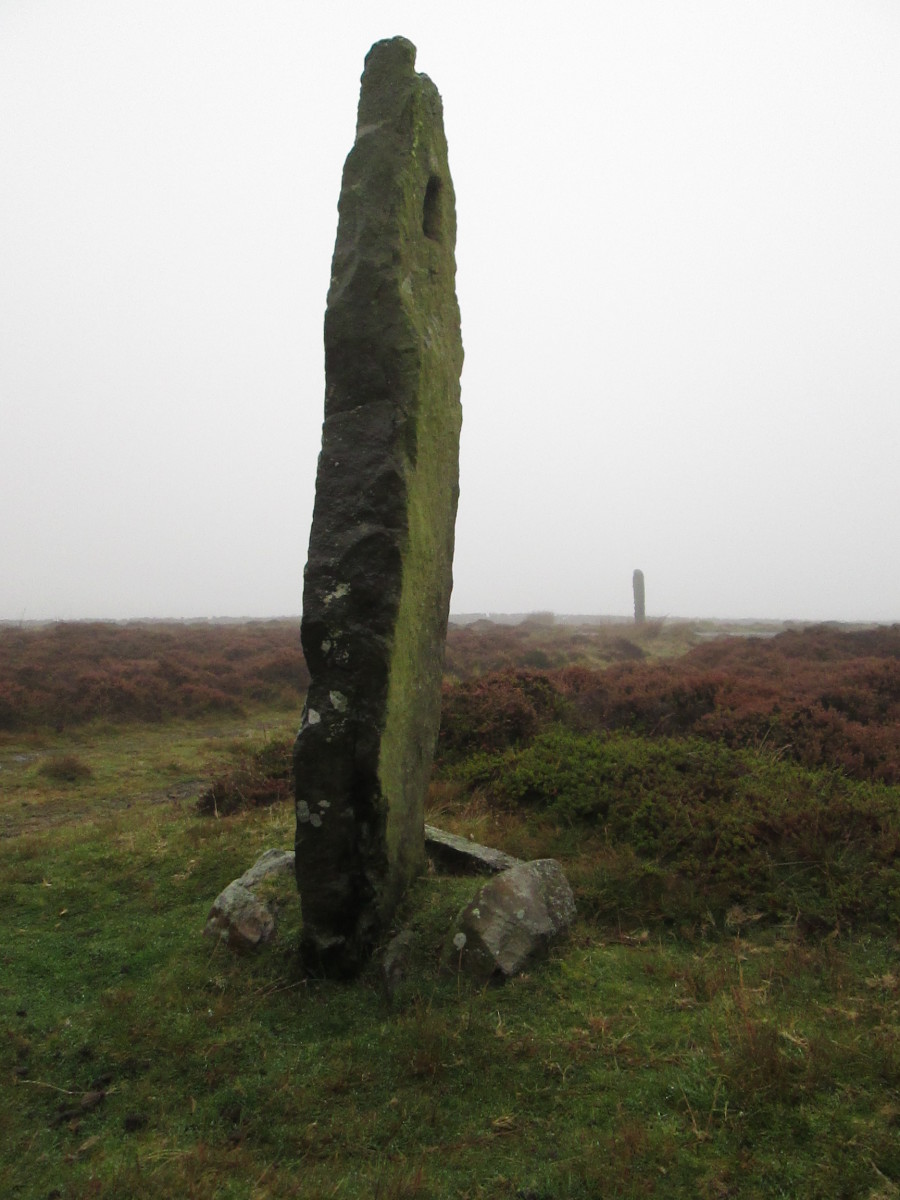 Further back on the Egton-Pickering moor road, another marker stands proud. There's a line of these - you can just see the other on the horizon - and this one has an interesting feature...