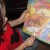 Each child gets a turn reading from a lift-the-flap Advent Calendar. Each child gets a turn reading from a lift-the-flap Advent Calendar.