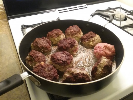 Cook on all sides of the meatballs until they are nicely browned all over. Remove the browned ones to a bowl or plate lined with paper towels and add more meatballs as room allows.